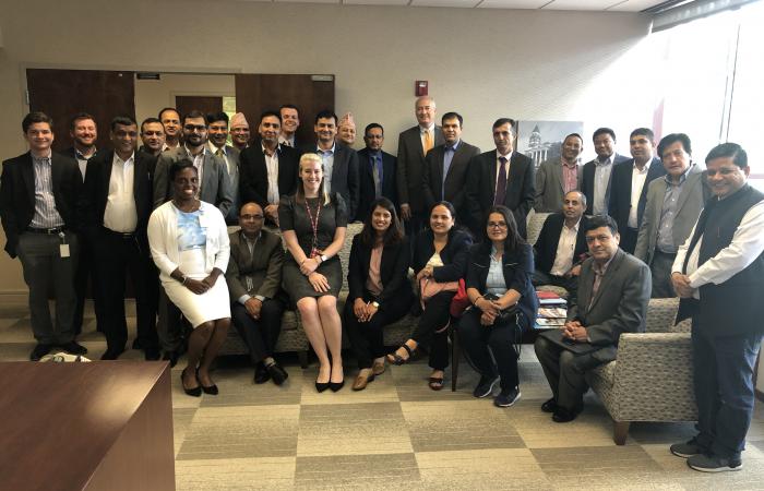Nepalese Finance Ministry members pose with DCA staff during their visit to the agency